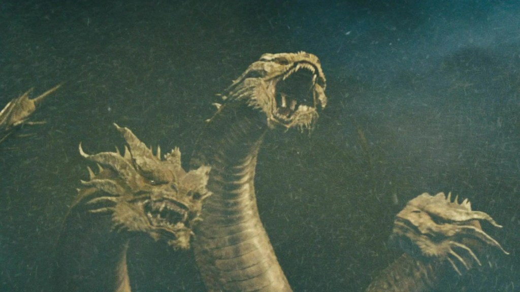 Nhân vật con người quan sát Godzilla trong bối cảnh căng thẳng