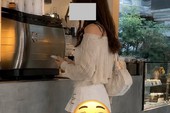 Người đẹp ngồi tạo dáng trong buổi chụp ảnh ngoài trời