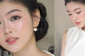 Cặp đôi đứng gần mép nước trong khung cảnh biển động