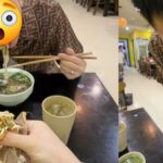 Cặp đôi ngồi dùng bữa tại một quán ăn bình dân